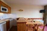 This charming studio apartment features a well-equipped kitchenette with a microwave and stovetop, perfect for preparing meals.