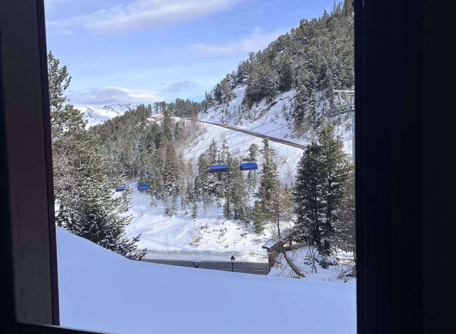 Experience breathtaking mountain views from this charming property, perfect for a ski getaway.