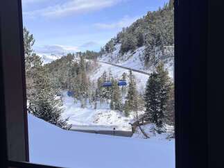 Experience breathtaking mountain views from this charming property, perfect for a ski getaway.