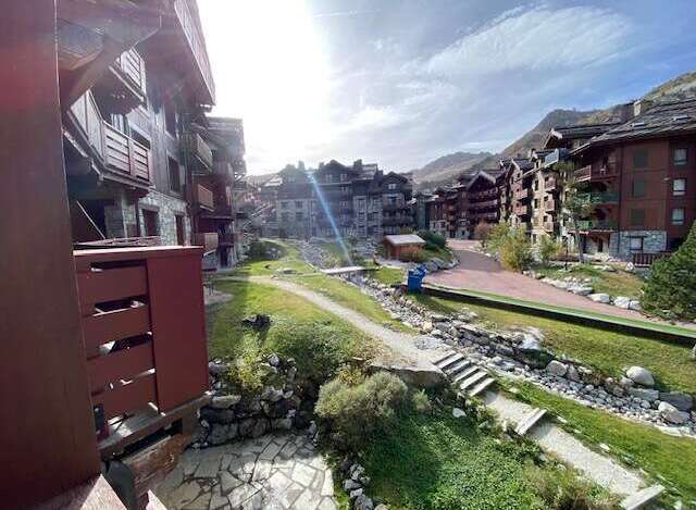 Experience mountain living in this charming alpine village setting, featuring traditional wooden chalets and stunning natural surroundings.