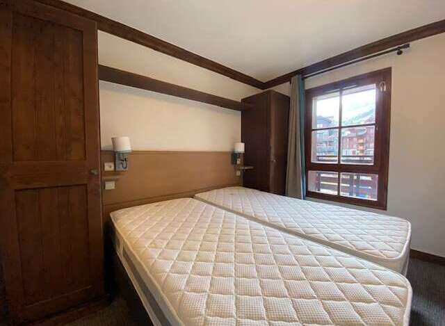 This charming bedroom features two comfortable twin beds, perfect for accommodating guests or family.