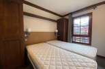 This charming bedroom features two comfortable twin beds, perfect for accommodating guests or family.