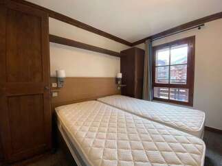 This charming bedroom features two comfortable twin beds, perfect for accommodating guests or family.