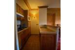 Discover this charming kitchen featuring warm wooden cabinetry and a functional layout.