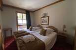 Experience comfort and tranquility in this charming hotel room, featuring two cozy twin beds perfect for a restful night's sleep.