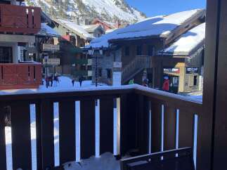 Experience the ultimate ski resort living from this charming balcony overlooking a picturesque mountain village.