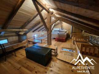 Discover this charming attic space, featuring a rustic wooden interior with exposed beams and multiple beds, perfect for accommodating guests or creating a cozy retreat.