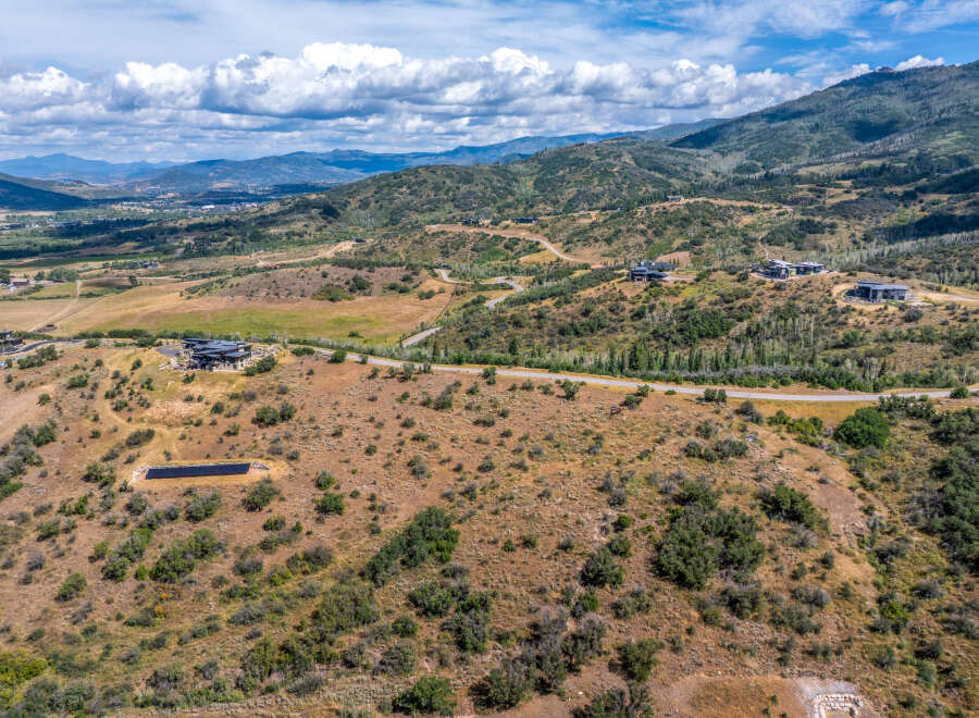 Discover luxury living in this expansive mountain estate, featuring modern architectural homes nestled into the scenic landscape.