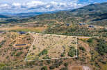 Discover this expansive parcel of land offering breathtaking panoramic views of the surrounding mountains and valley.