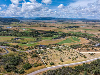 Discover this prime building lot offering breathtaking panoramic views of the surrounding mountains and golf course.