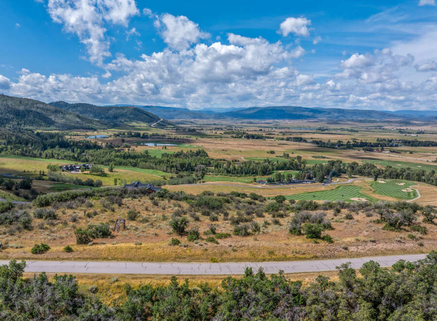 Discover this stunning property offering breathtaking panoramic views of rolling hills, lush green golf courses, and distant mountains.