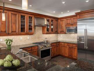 This spacious kitchen boasts custom cherry wood cabinetry, offering a warm and inviting aesthetic.