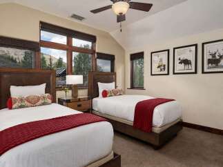 Experience comfort and style in this charming bedroom featuring two twin beds, perfect for guests or family.