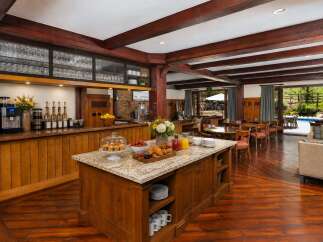 Experience luxury living with this stunning property featuring a well-appointed breakfast bar and a spacious kitchen island, perfect for entertaining.