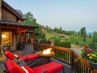 Experience the ultimate mountain retreat with this stunning property featuring a spacious deck perfect for entertaining.