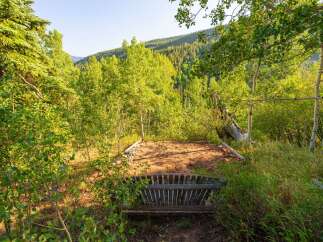 Discover a serene mountain retreat nestled amidst lush aspen and pine forests.