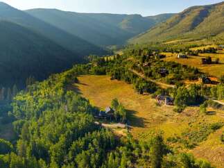 Nestled in a picturesque mountain valley, this stunning property offers a serene escape with breathtaking views.