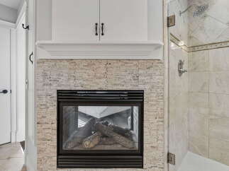 Experience luxury and comfort with this stunning fireplace, perfect for cozy evenings.