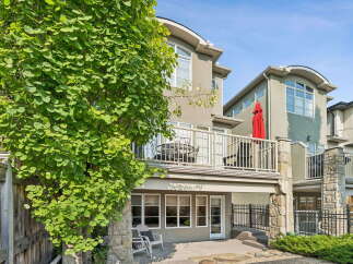 Enjoy outdoor living with this property's multi-level balconies and a walk-out basement leading to a private patio.