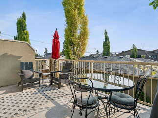 Enjoy outdoor living on this spacious balcony, perfect for entertaining or relaxing.