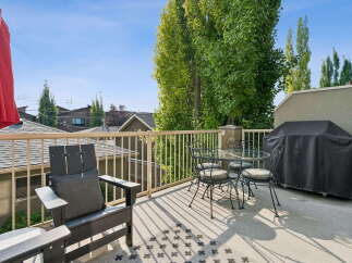 Enjoy outdoor living on this spacious deck, perfect for entertaining or relaxing.