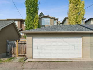 Discover this charming property featuring a spacious two-car garage, perfect for vehicle storage and additional workspace.