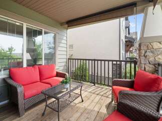 Enjoy outdoor living on this charming covered deck, perfect for relaxing or entertaining.