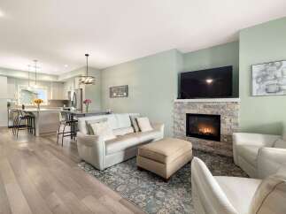 Experience modern living in this open-concept home featuring a spacious kitchen with a large island and ample cabinet space.