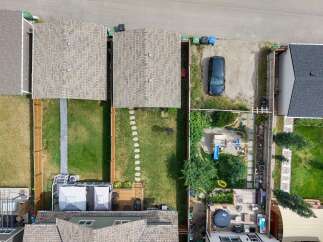 Discover this charming property featuring a spacious backyard with a playground, perfect for family fun.