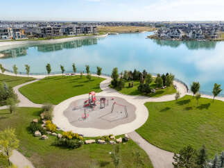 Discover modern lakeside living in this stunning community featuring a vibrant playground and serene walking paths.
