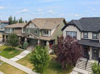 Discover modern living in this stunning townhome featuring a welcoming porch and elegant architectural details.