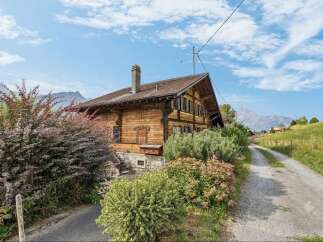 Experience rustic charm in this traditional wooden chalet nestled amidst breathtaking mountain scenery.