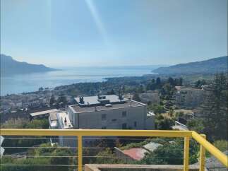 Experience breathtaking panoramic views of the serene lake and surrounding mountains from this stunning property.