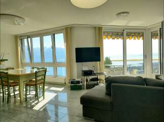 Experience breathtaking lake and mountain views from this stunning living space.