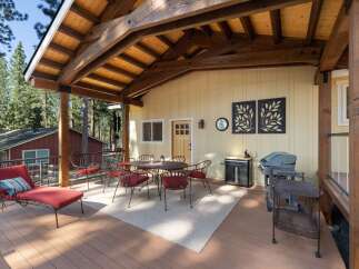 Enjoy outdoor living on this spacious deck, perfect for entertaining or relaxing.