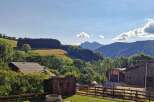 Nestled amidst rolling green hills and majestic mountains, this property offers a serene escape.