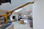 Discover this charming studio apartment featuring a well-equipped kitchen with modern appliances and a cozy living area.