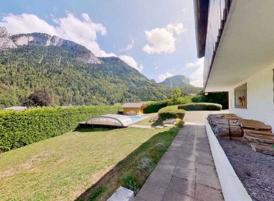 Escape to this stunning mountain retreat featuring a private swimming pool and a charming pool house, perfect for relaxation and entertainment.