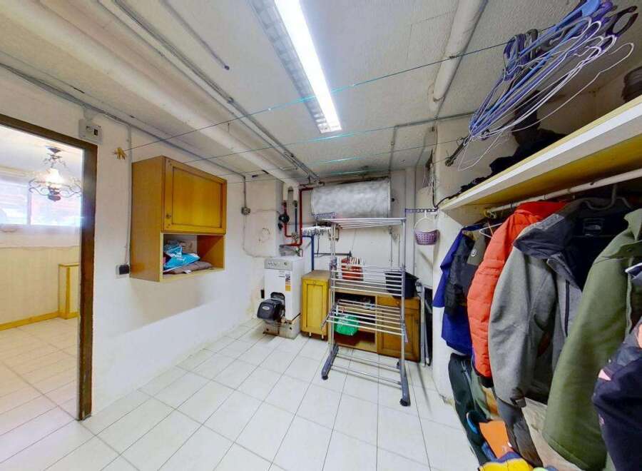 Discover a functional laundry room and storage area, perfect for keeping your home organized.