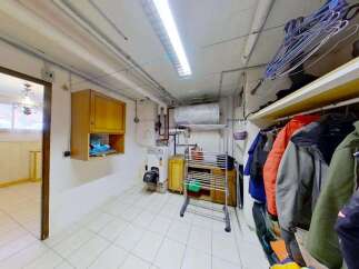 Discover a functional laundry room and storage area, perfect for keeping your home organized.
