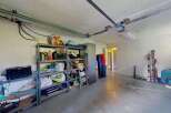 Discover ample storage solutions in this versatile garage space, perfect for organizing all your recreational gear and equipment.