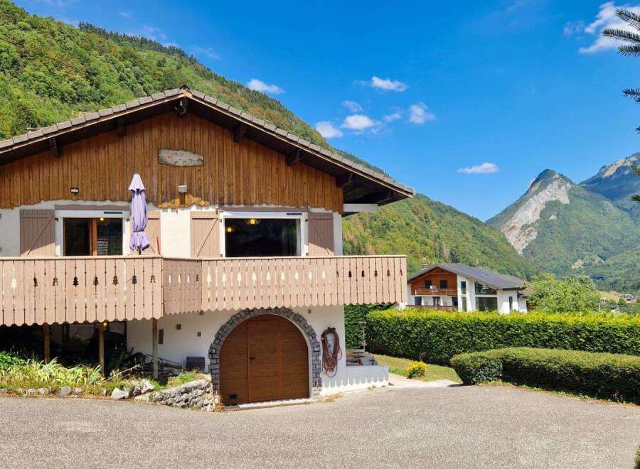 Nestled in a picturesque mountain setting, this charming chalet offers a serene retreat.