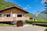 Nestled in a picturesque mountain setting, this charming chalet offers a serene retreat.