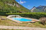 Escape to this stunning mountain retreat featuring a beautiful swimming pool with a retractable cover, perfect for year-round enjoyment.