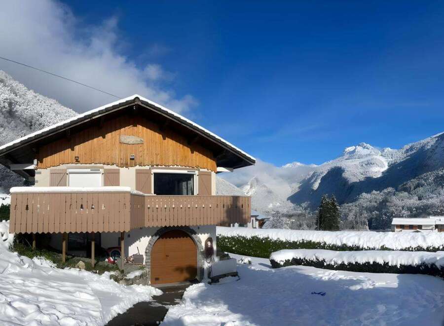Experience the charm of this picturesque mountain chalet, nestled amidst a winter wonderland.
