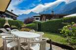 Enjoy breathtaking mountain views from this charming property's outdoor patio, complete with a dining set and lounge chairs.