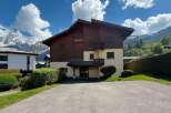 Experience mountain living in this charming property featuring a blend of traditional wood and modern design.