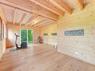 Discover this unique wooden cabin, perfect for a home gym or yoga studio.
