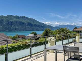 Enjoy breathtaking lake and mountain views from this stunning property's expansive balcony.
