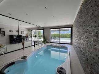 Experience luxury indoor living with this stunning property featuring a sleek indoor swimming pool.